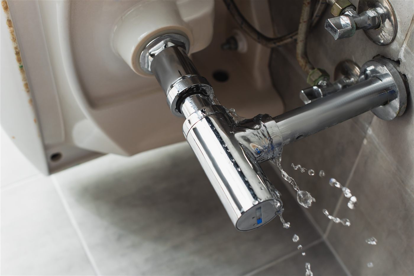 Emergency plumbing repair for leaking pipe under sink