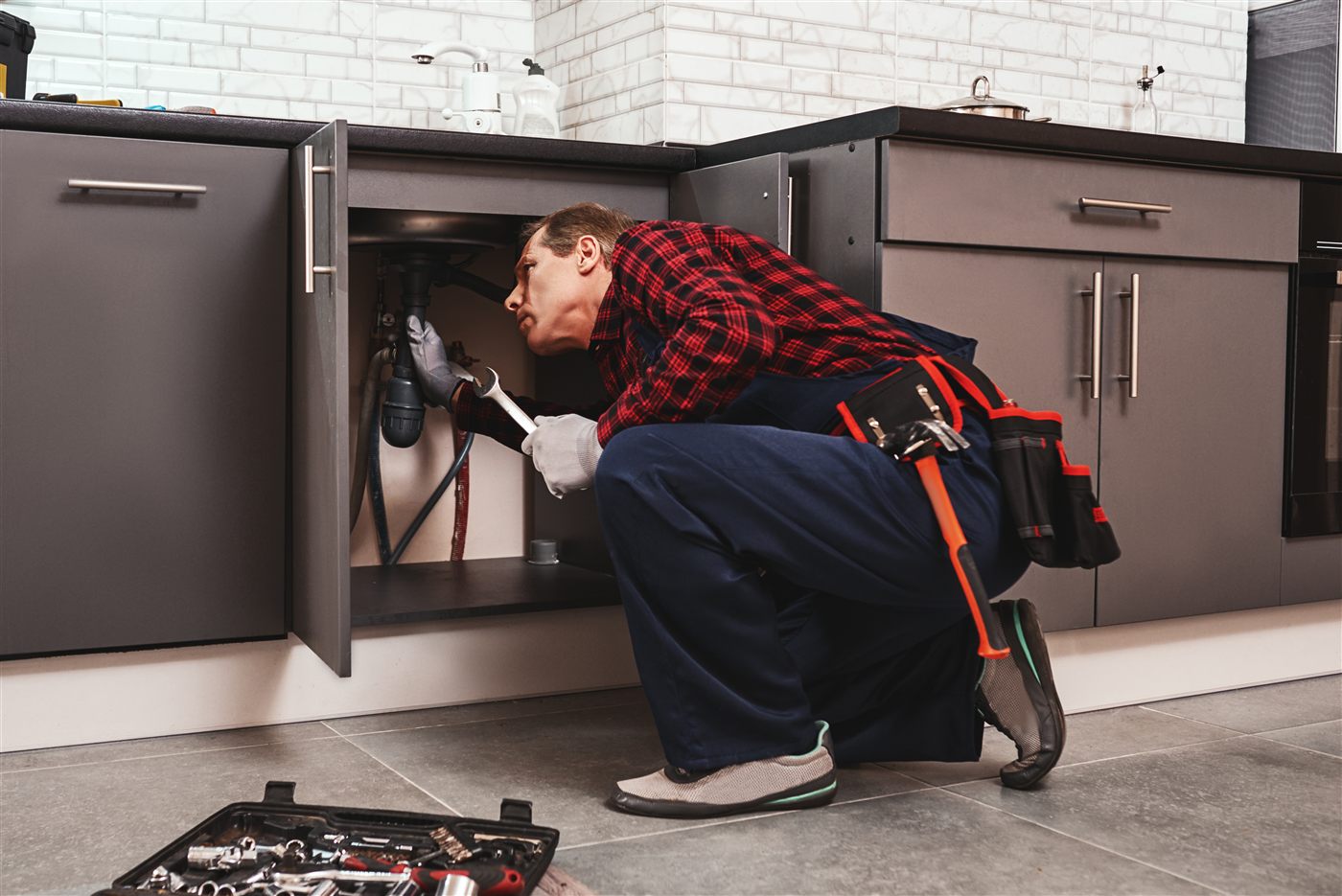 Pipe fitting repair with wrench for local plumbing repair service